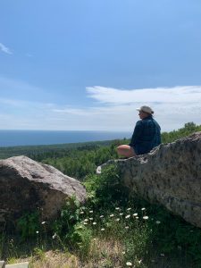 Lara Moll sitting on a rock in Duluth